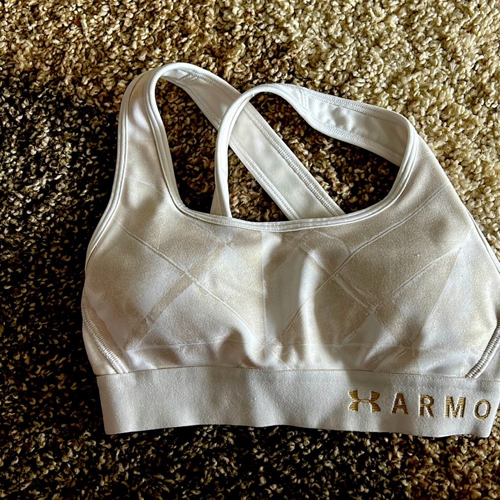 Under Armour white and gold (metallic) cross strap sports bra. Size XS